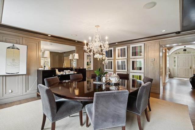 99 Wheatley Rd, Old Westbury, NY 11568 - dining space with a chandelier, wood finished floors, crown molding, and recessed lighting