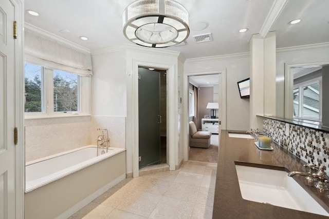 99 Wheatley Rd, Old Westbury, NY 11568 - full bathroom with a shower stall, a garden tub, a sink, ornamental molding, and visible vents