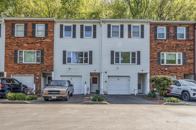 74 Foltim Way, Congers, NY 10920 - view of property featuring brick siding, driveway, and a garage