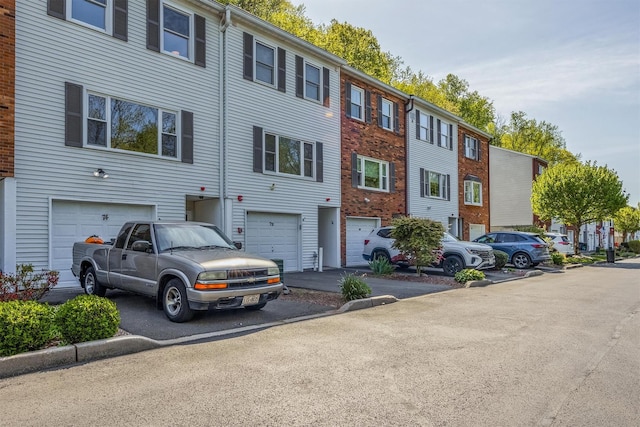 74 Foltim Way, Congers, NY 10920 - view of front of house with driveway, a residential view, and a garage
