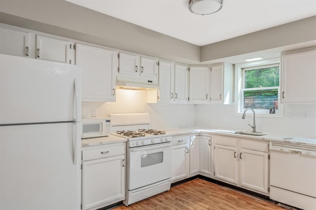 74 Foltim Way, Congers, NY 10920 - kitchen featuring under cabinet range hood, light countertops, white cabinetry, and white appliances