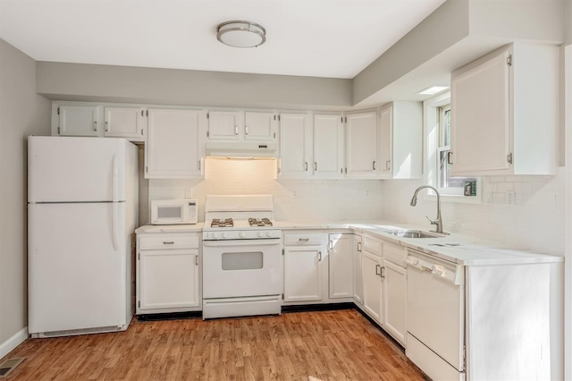 74 Foltim Way, Congers, NY 10920 - kitchen with white cabinets, a sink, and white appliances