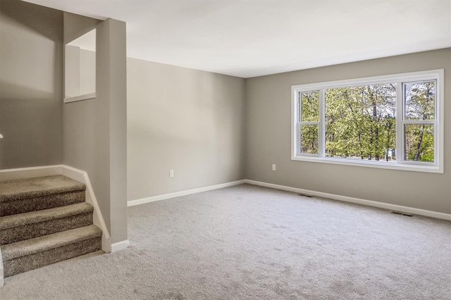74 Foltim Way, Congers, NY 10920 - carpeted spare room featuring stairway, baseboards, and visible vents
