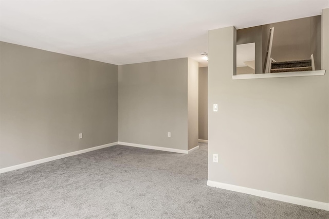 74 Foltim Way, Congers, NY 10920 - carpeted empty room with stairway and baseboards