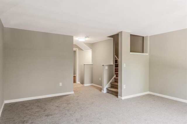 74 Foltim Way, Congers, NY 10920 - empty room with baseboards, stairway, and light colored carpet