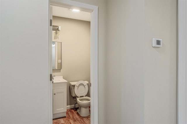 74 Foltim Way, Congers, NY 10920 - half bath with toilet, vanity, and wood finished floors