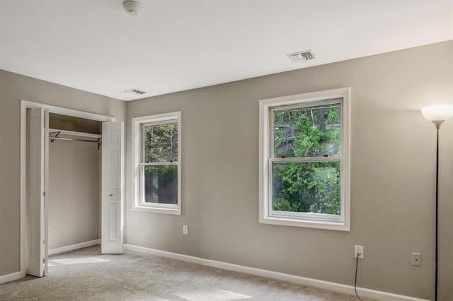 74 Foltim Way, Congers, NY 10920 - unfurnished bedroom featuring light colored carpet, a closet, visible vents, and baseboards