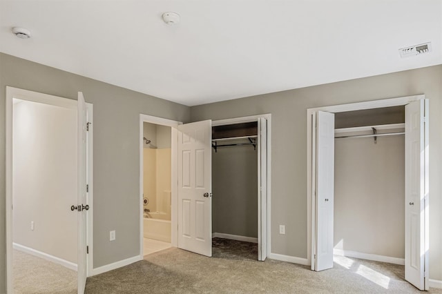 74 Foltim Way, Congers, NY 10920 - unfurnished bedroom featuring two closets, carpet flooring, baseboards, and visible vents