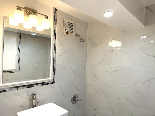 bathroom with recessed lighting, a sink, and a shower