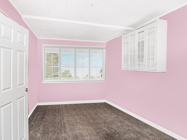 unfurnished bedroom with carpet floors and baseboards