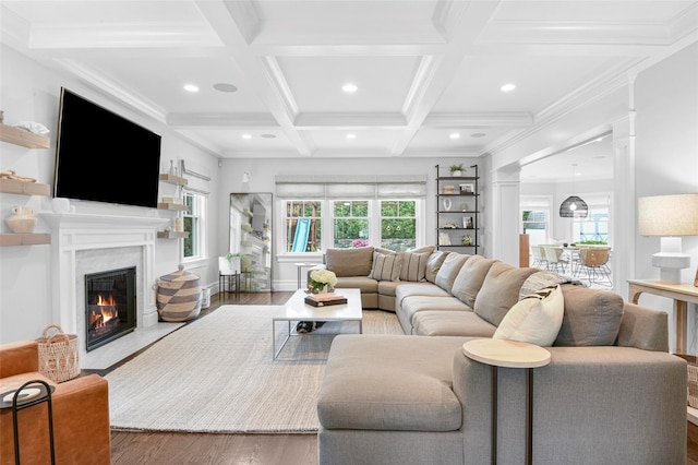living area with recessed lighting, coffered ceiling, wood finished floors, a fireplace, and beam ceiling