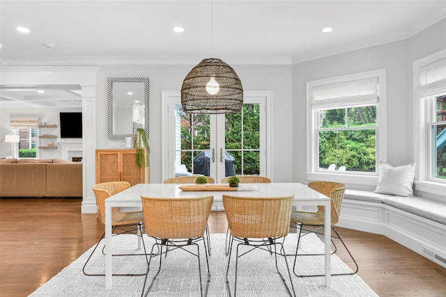 dining area featuring french doors, wood finished floors, visible vents, ornamental molding, and recessed lighting