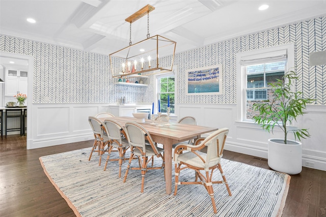 dining area featuring beam ceiling and wallpapered walls