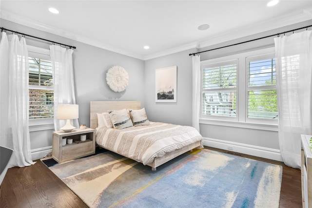 bedroom featuring multiple windows, wood finished floors, ornamental molding, and recessed lighting