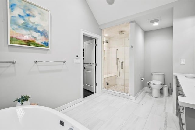 bathroom with toilet, vanity, a stall shower, vaulted ceiling, and a freestanding tub