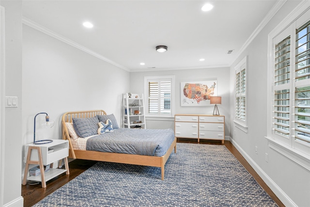 bedroom with ornamental molding, recessed lighting, and wood finished floors