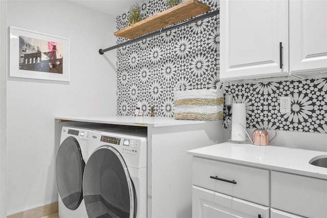 laundry room featuring cabinet space and washing machine and dryer