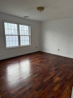 45 Manor Dr W, Poughkeepsie, NY 12603 - empty room featuring baseboards and dark wood-type flooring