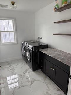 45 Manor Dr W, Poughkeepsie, NY 12603 - laundry room featuring cabinet space, washer and clothes dryer, light marble finish floors, and baseboards