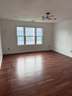 45 Manor Dr W, Poughkeepsie, NY 12603 - unfurnished room with healthy amount of natural light, baseboards, wood finished floors, and a chandelier