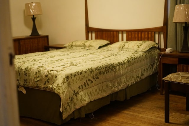 bedroom featuring wood finished floors