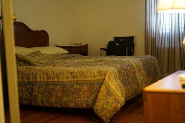 bedroom with wood finished floors