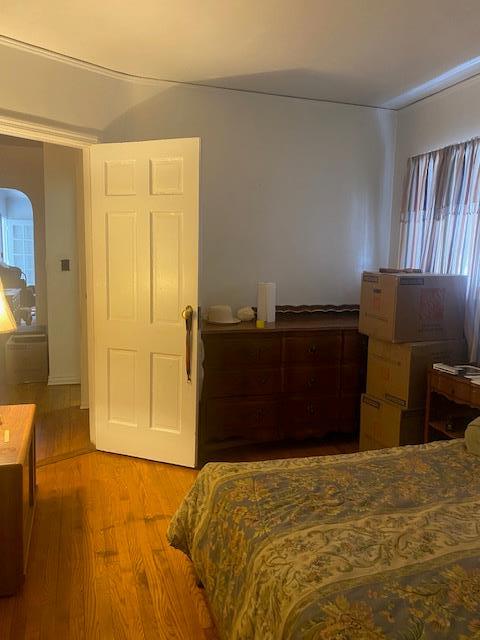 bedroom featuring wood finished floors
