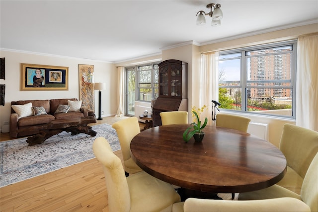 2500 Johnson Ave Unit 2Np, Bronx, NY 10463 - dining room featuring baseboards, ornamental molding, and light wood-style flooring