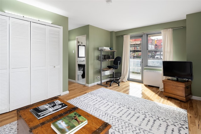 2500 Johnson Ave Unit 2Np, Bronx, NY 10463 - bedroom with an office area, access to outside, wood finished floors, baseboards, and ensuite bath
