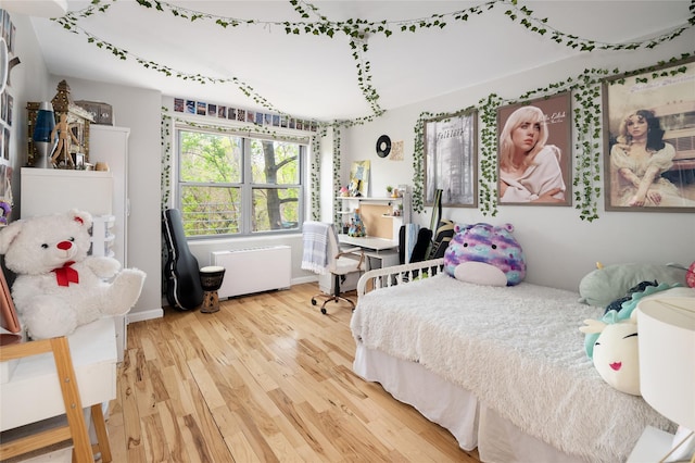 2500 Johnson Ave Unit 2Np, Bronx, NY 10463 - bedroom with radiator, wood finished floors, and baseboards