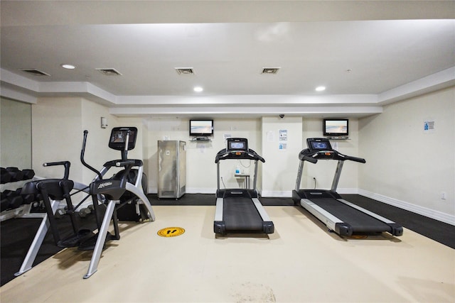 exercise room featuring baseboards, recessed lighting, and visible vents