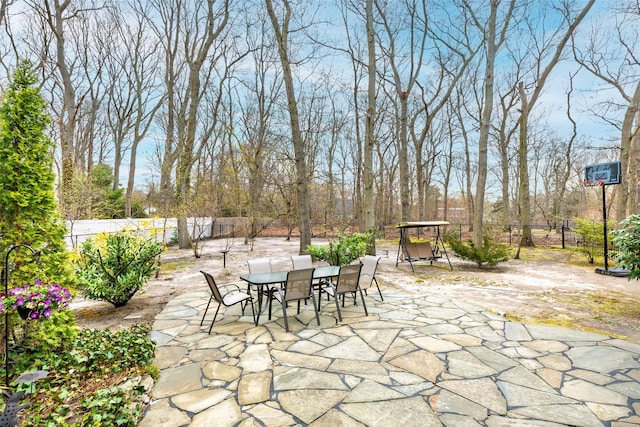 view of patio with fence and outdoor dining area