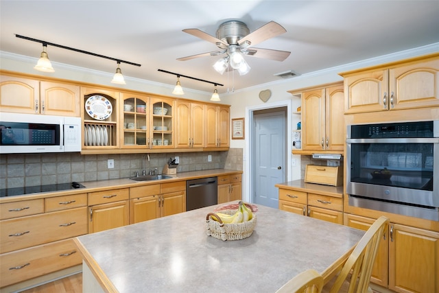 kitchen with oven, white microwave, black electric cooktop, a sink, and dishwasher