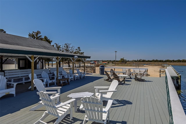 wooden deck with a water view