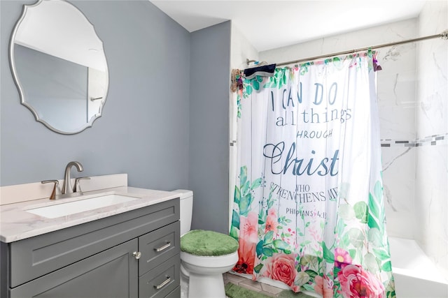 bathroom with shower / bath combo with shower curtain, toilet, and vanity