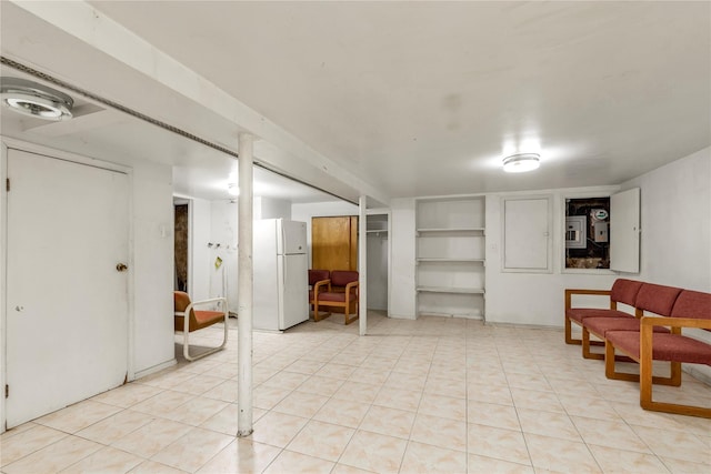 finished below grade area featuring built in features and freestanding refrigerator