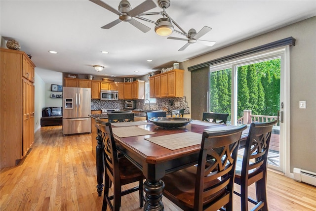 dining room featuring light wood-style floors, recessed lighting, ceiling fan, and baseboard heating