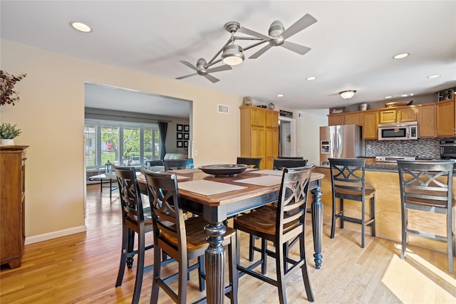 dining space with ceiling fan, recessed lighting, light wood-style flooring, and visible vents