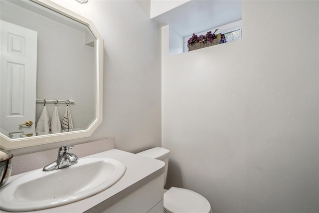 half bath with vanity and toilet