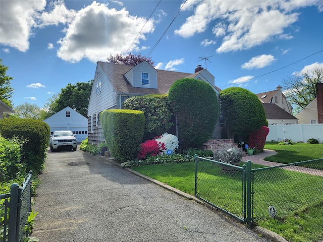 112 Rutland Rd, Hempstead, NY 11550 - view of property exterior featuring a garage, an outdoor structure, and a chimney