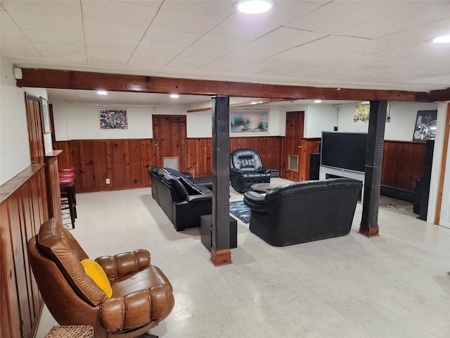 112 Rutland Rd, Hempstead, NY 11550 - living room with wainscoting, wood walls, and light floors