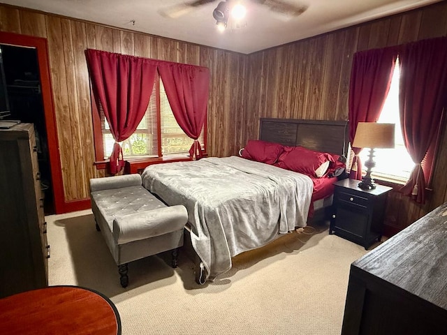 112 Rutland Rd, Hempstead, NY 11550 - carpeted bedroom with wood walls and a ceiling fan