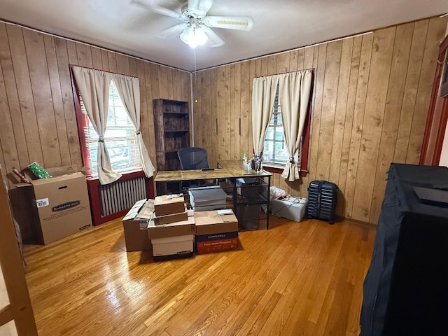 112 Rutland Rd, Hempstead, NY 11550 - office area with a ceiling fan, light wood-type flooring, and wood walls