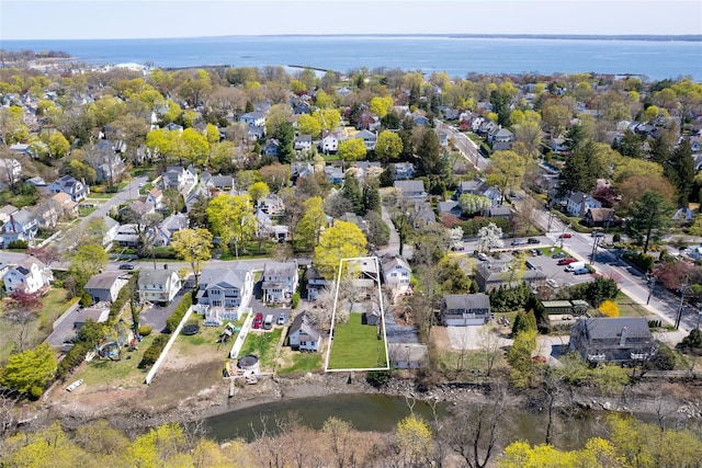 aerial view featuring a residential view and a water view