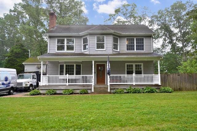 20 Richmond Blvd, Lake Grove, NY 11755 - view of front of property featuring a chimney and covered porch