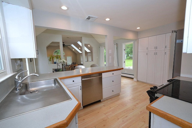 20 Richmond Blvd, Lake Grove, NY 11755 - kitchen with dishwasher, a ceiling fan, a baseboard heating unit, white cabinetry, and recessed lighting