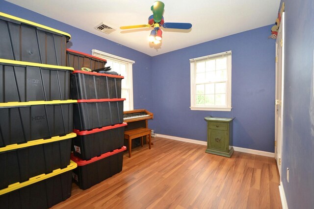 20 Richmond Blvd, Lake Grove, NY 11755 - home office with wood finished floors, healthy amount of natural light, and ceiling fan