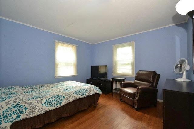 20 Richmond Blvd, Lake Grove, NY 11755 - bedroom featuring wood finished floors and ornamental molding