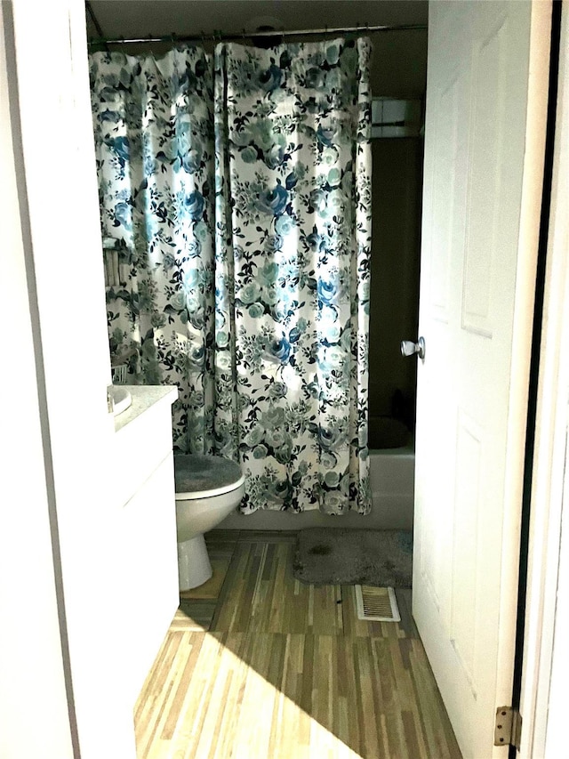 20 Richmond Blvd, Lake Grove, NY 11755 - bathroom with vanity, shower / tub combo with curtain, and wood finished floors