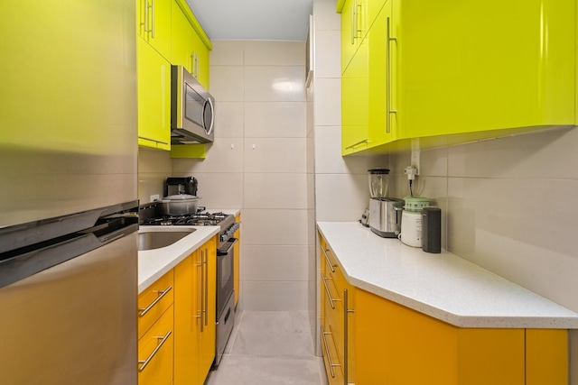 83-25 98th St Unit 3T, Woodhaven, NY 11421 - kitchen with appliances with stainless steel finishes and tile walls
